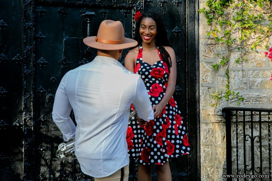 saxophonist standing by smiling woman in dress